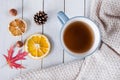 CupÃÂ ofÃÂ teaÃÂ withÃÂ decorationsÃÂ onÃÂ aÃÂ whiteÃÂ woodenÃÂ table